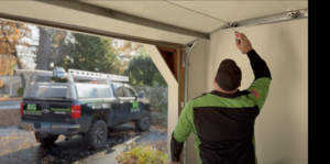 Big Guy inspecting a garage door and track